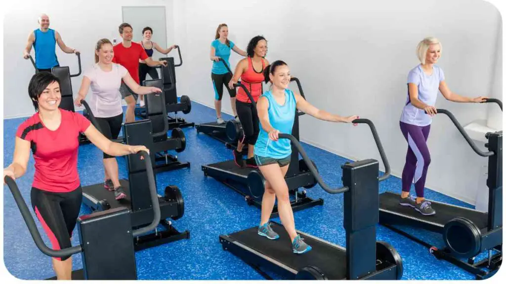 a group of people on treadmills in a gym
